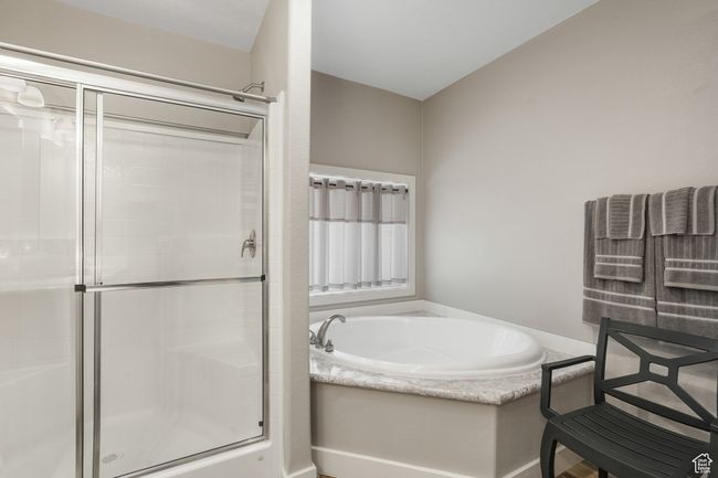 Full bath with a shower stall and a bath | Image 8