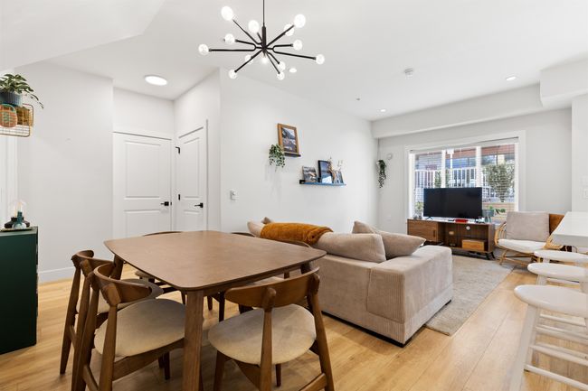 Dining space with light wood-style flooring, recessed lighting, an inviting chandelier, and baseboards | Image 19