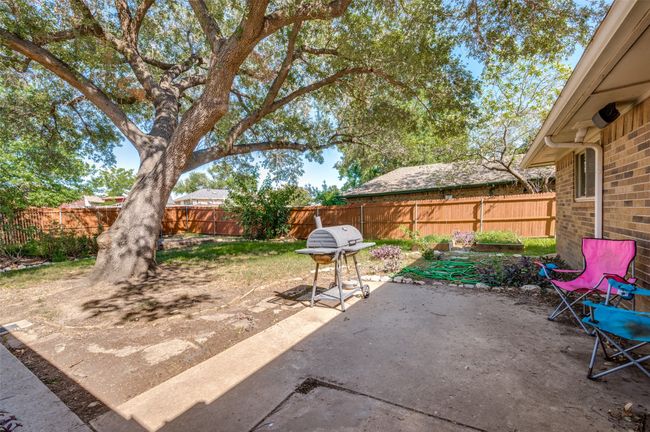 Fenced backyard featuring a patio area | Image 24