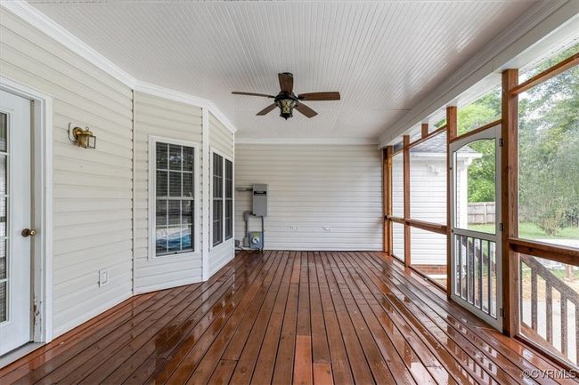 Unfurnished sunroom featuring ceiling fan | Image 41