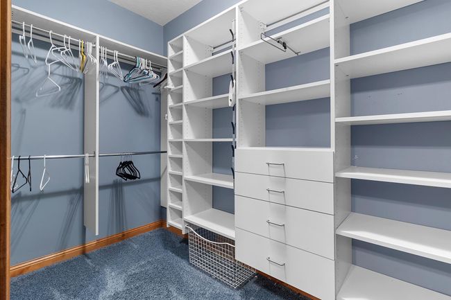 Lower-level first bedroom suite with walk-in closet. | Image 54