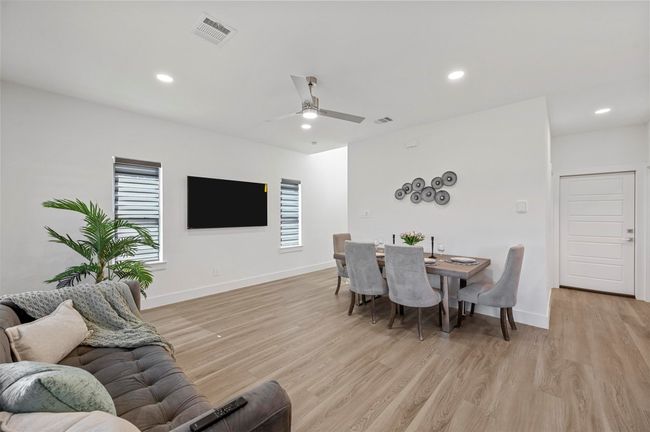 Dining area featuring light wood-style flooring, recessed lighting, and ceiling fan | Image 6