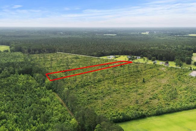 Aerial overview of property's location with a forest and property boundaries highlighted | Image 14