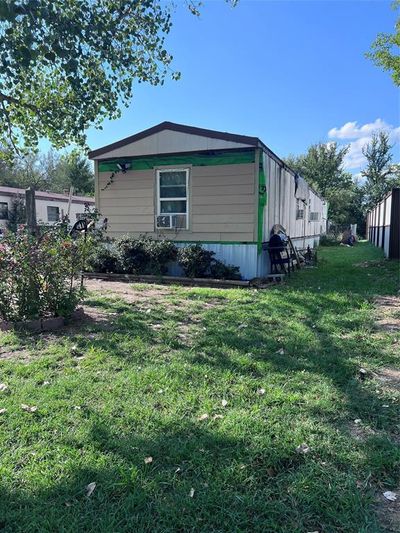 View of side of property featuring a yard | Image 2