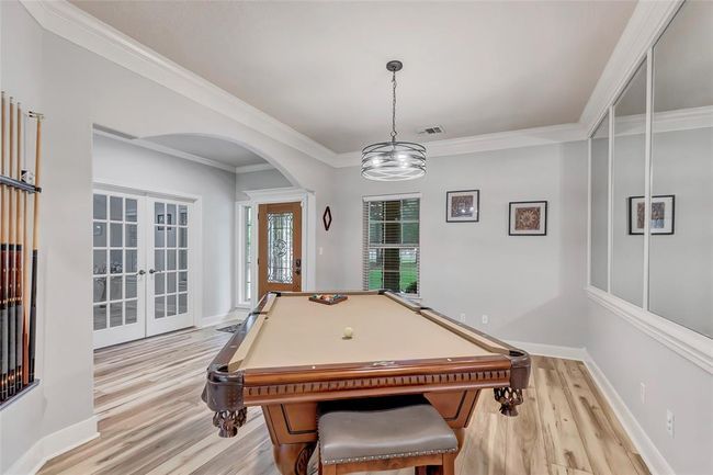 Formal Dining area, currently beings used for a pool table room | Image 10