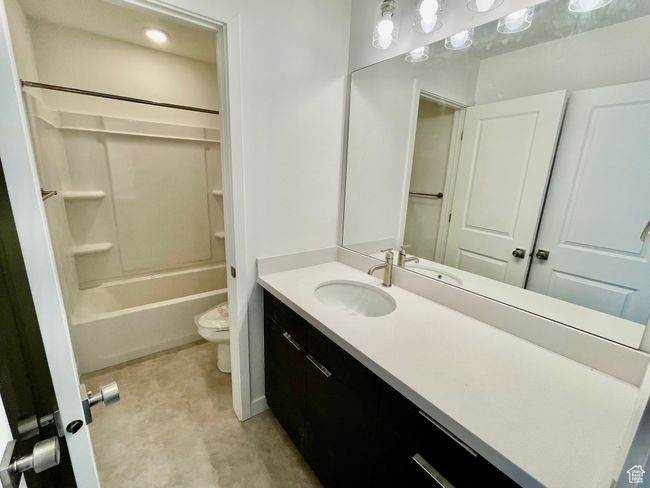 Bathroom featuring vanity and shower / bath combination | Image 18