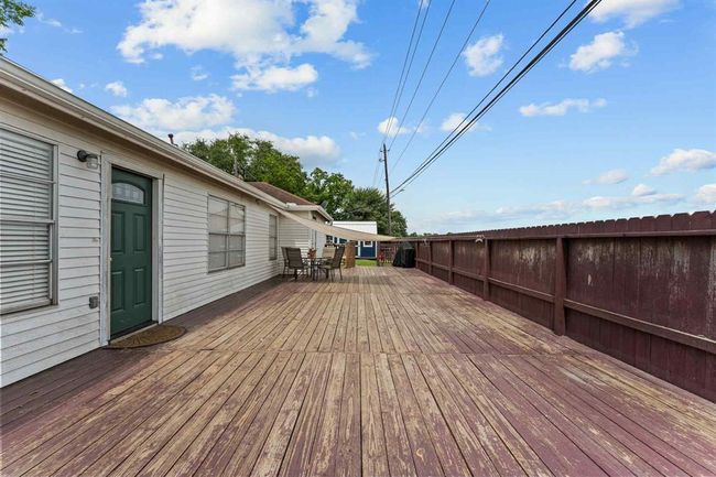 Step out onto this spacious deck — the perfect spot for morning coffee, summer BBQs, and endless outdoor fun | Image 25
