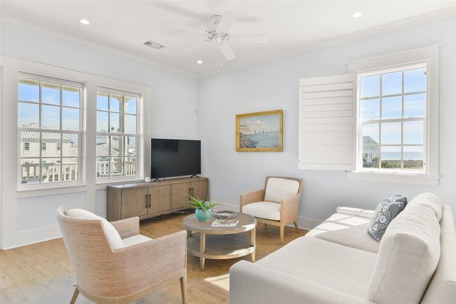 Living room features 10ft ceilings, custom window treatments, and plenty of natural lighting. | Image 7