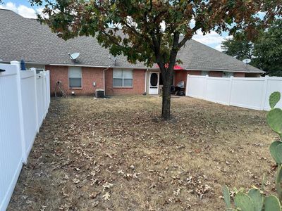 Rear view of house with central AC | Image 2