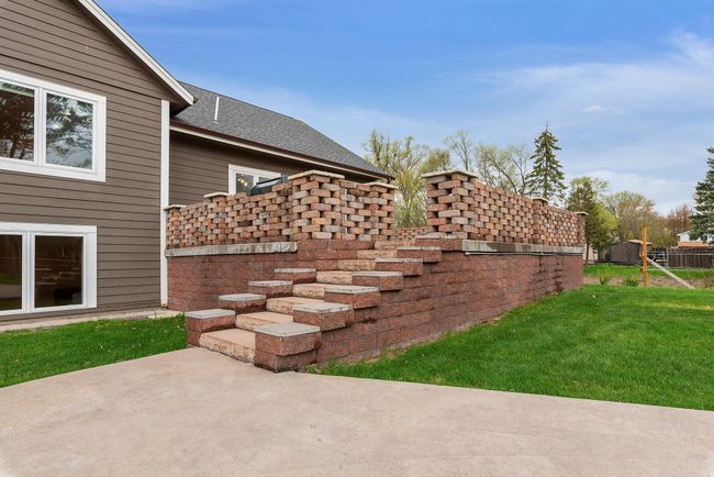 This castle-like patio is incredibly well built with no detail spared; the columns are even pre-wired for lights | Image 49