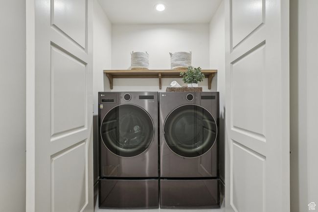 Washroom featuring laundry area, washing machine and clothes dryer, and recessed lighting | Image 48