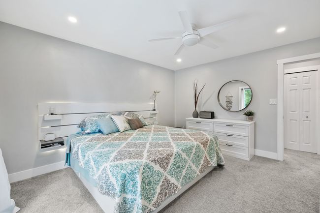 Bedroom with light carpet, baseboards, a ceiling fan, and recessed lighting | Image 24