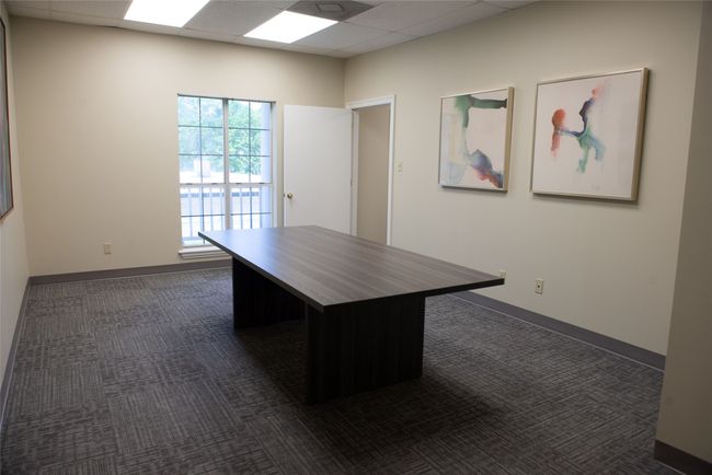 Unfurnished office featuring dark carpet, baseboards, and a paneled ceiling | Image 16