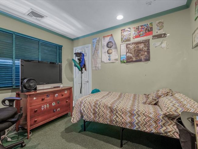 Bedroom with crown molding and carpet floors | Image 25