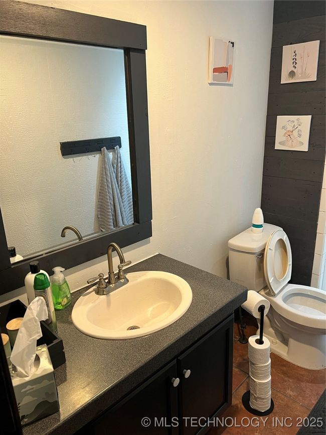 Half bathroom with toilet and vanity | Image 25