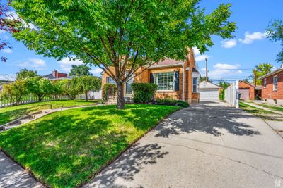 View of front of house featuring a garage and a front yard | Image 3