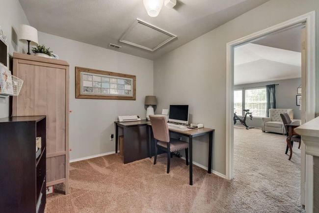 Carpeted office space featuring attic access and baseboards | Image 22