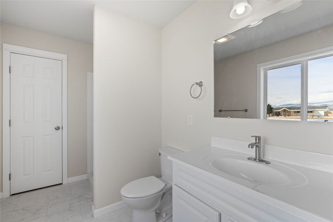 Full bath with baseboards, marble finish floor, toilet, and vanity | Image 48