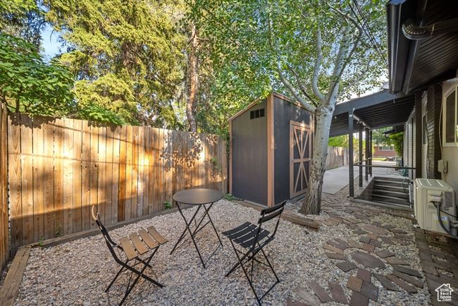Fenced backyard with a patio area and a cooling unit | Image 27