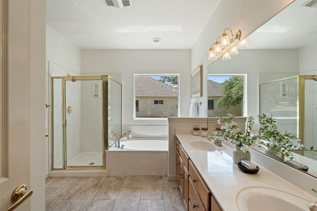 Enjoy the option of a soak in the garden tub or a refreshing shower. | Image 19
