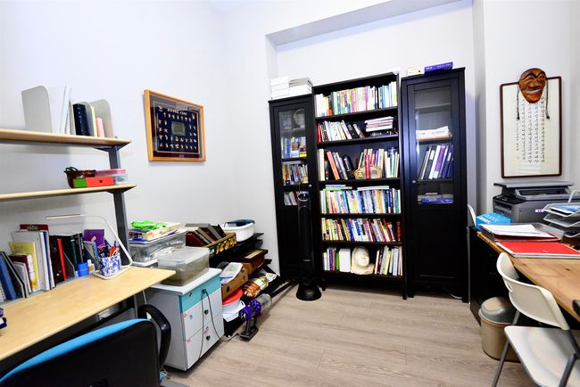 Office with light wood-type flooring | Image 9