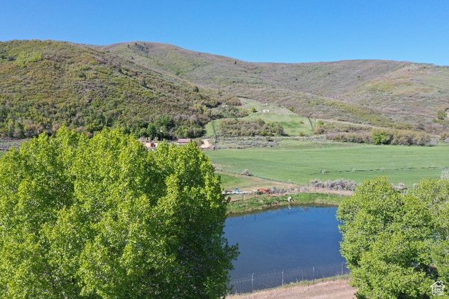 View of mountain background with a nearby body of water | Image 40