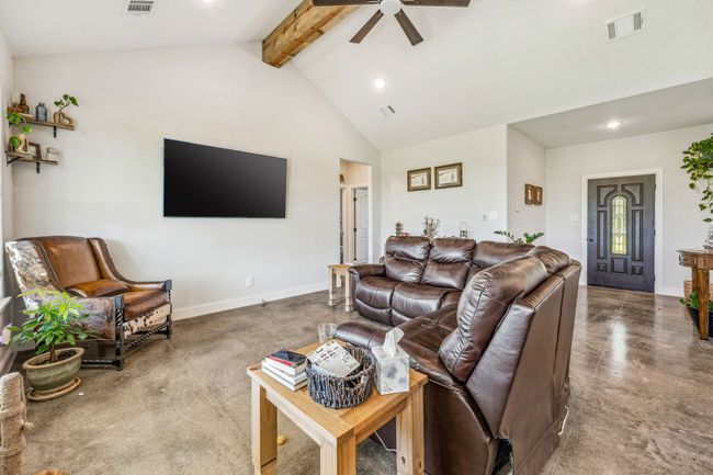 Living room featuring beam ceiling, ceiling fan, recessed lighting, high vaulted ceiling, and baseboards | Image 5