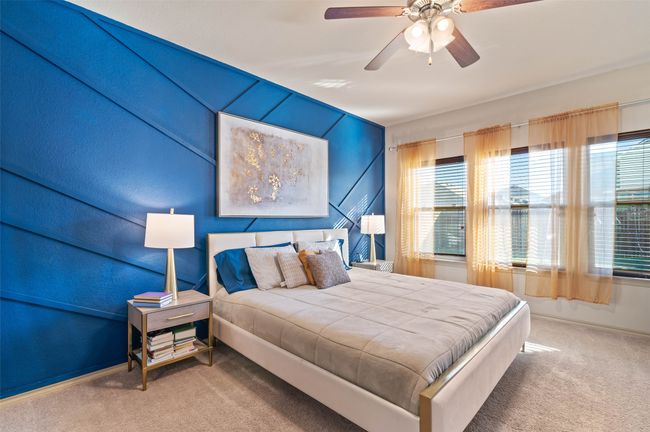 Bedroom with carpet floors, ceiling fan, and baseboards | Image 9