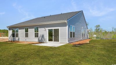 Not Home. Picture is Representative of our Easton floorplan. View of front of property with a front yard and a garage | Image 3