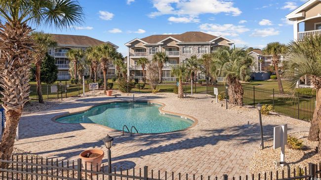 Community pool featuring a patio area | Image 25