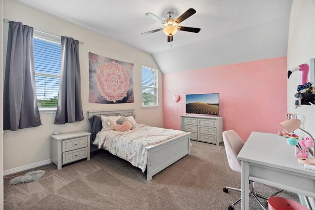 Each of the upstairs bedrooms offers plenty of room to personalize, with large windows that flood the space with natural light | Image 27