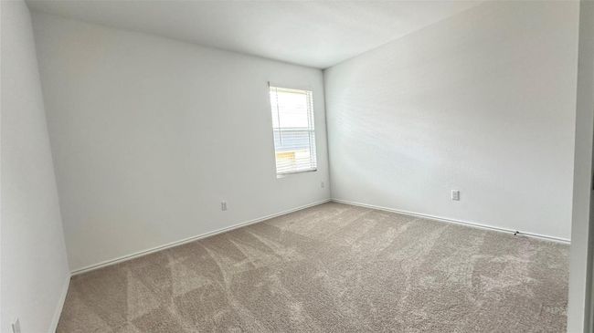 Carpeted spare room with baseboards | Image 11