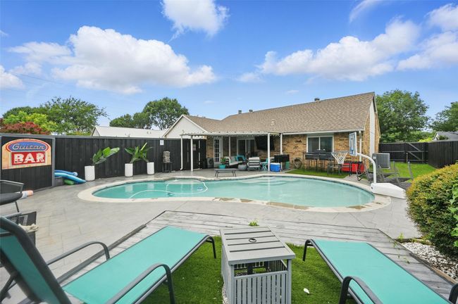 View of pool featuring a fenced backyard, an outdoor living space, and a patio | Image 33