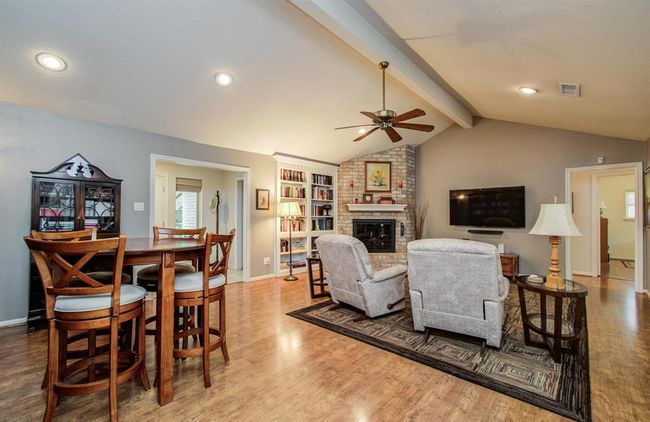 More stunning hardwood floors that extend through the hallway to bedrooms. Plus large built-in bookases. | Image 10