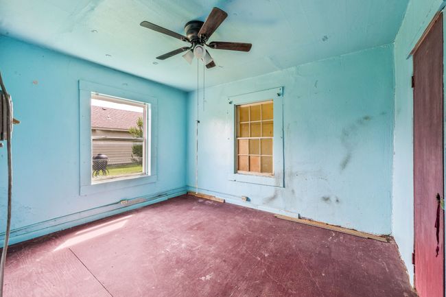 Empty room featuring a ceiling fan | Image 12