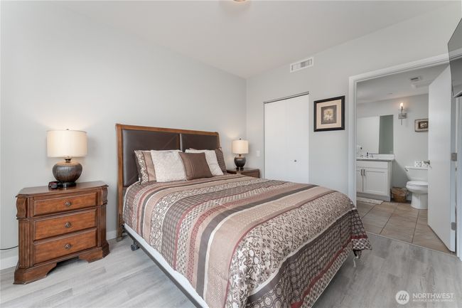 The spacious en-suite primary bedroom is waiting to give you a restful night after a long day of playing at the Lake! | Image 14