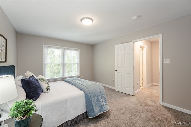 Bedroom 2 with light carpet and baseboards | Image 37