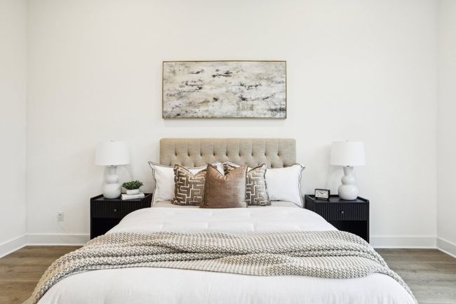 Bedroom with baseboards and wood finished floors | Image 26