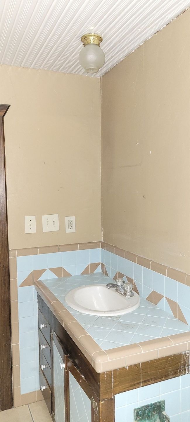 Bathroom with vanity and tile patterned flooring | Image 15