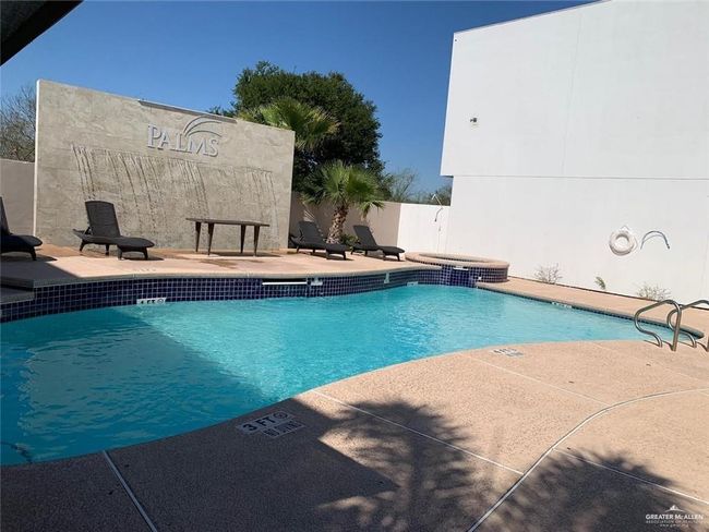 Community pool with fence and a patio area perfect for this Summer's fund! | Image 4