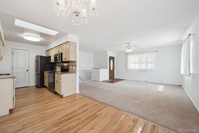 Dining/kitchen Area with hardwood floors, opens to living room | Image 7