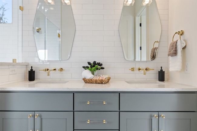 Full bathroom featuring double vanity, a sink, and decorative backsplash | Image 18