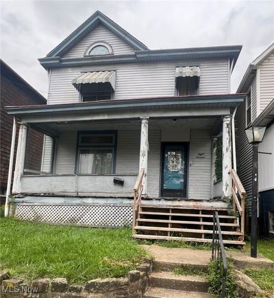 View of front facade featuring a porch | Image 1