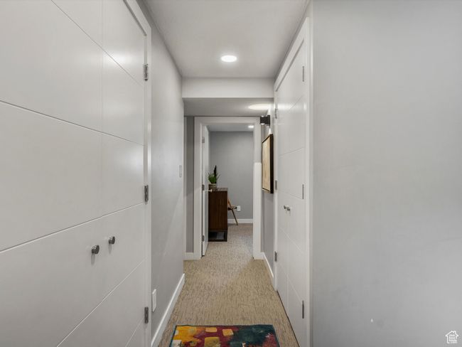 Hall with light carpet and recessed lighting | Image 29