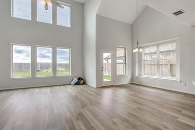 This view shows the open plan from the den to the breakfast area, just off the kitchen | Image 2