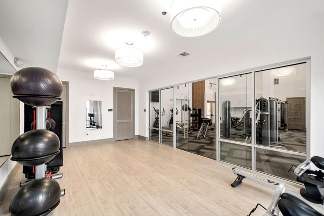 Exercise room with wood-type flooring | Image 23