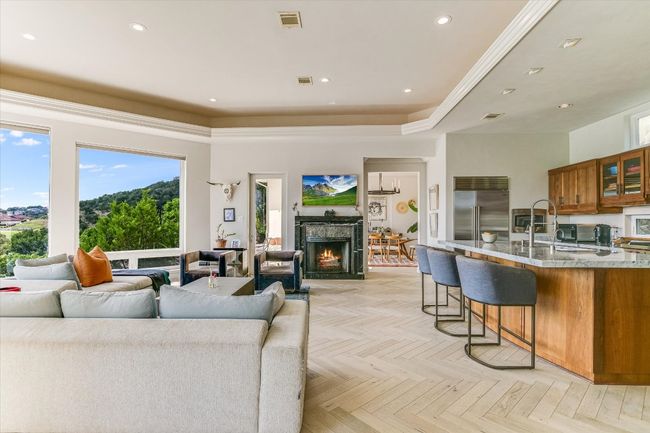 Living area with a premium fireplace and recessed lighting | Image 8