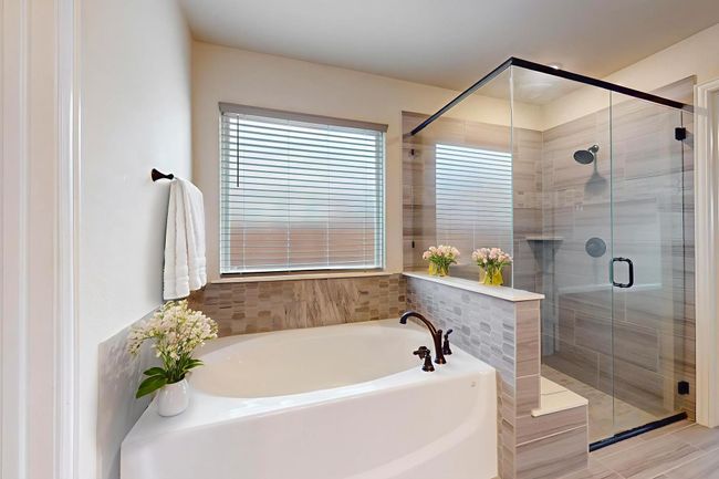 Bathroom with a garden tub and a stall shower | Image 11