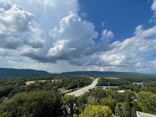 Above, the canvas of the sky is an ever-changing masterpiece. On clear days, the brilliant blue stretches as far as the eye can see. When clouds drift by, they paint an ethereal picture, casting playful shadows on the landscape below. | Image 19