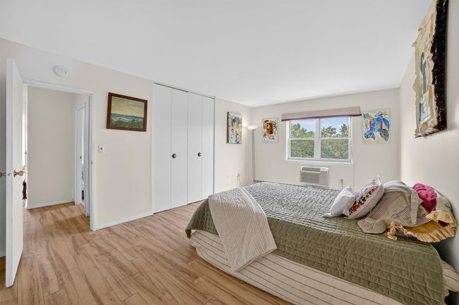 Bedroom featuring light wood-style floors and a closet | Image 29